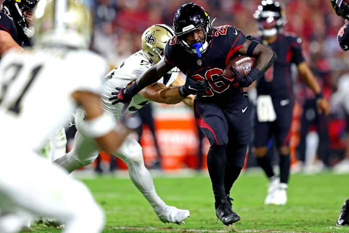 Oct 20, 2022; Arizona Cardinals running back Eno Benjamin (26) runs past New Orleans Saints linebacker Zack Baun (53). Mandatory Credit: Mark J. Rebilas-USA TODAY